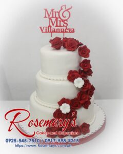 Delicious 3-layer red and white wedding cake with a custom 3D printed topper. For stunning celebration cakes, call Rosemary's Cakes: 0925-545-7510.