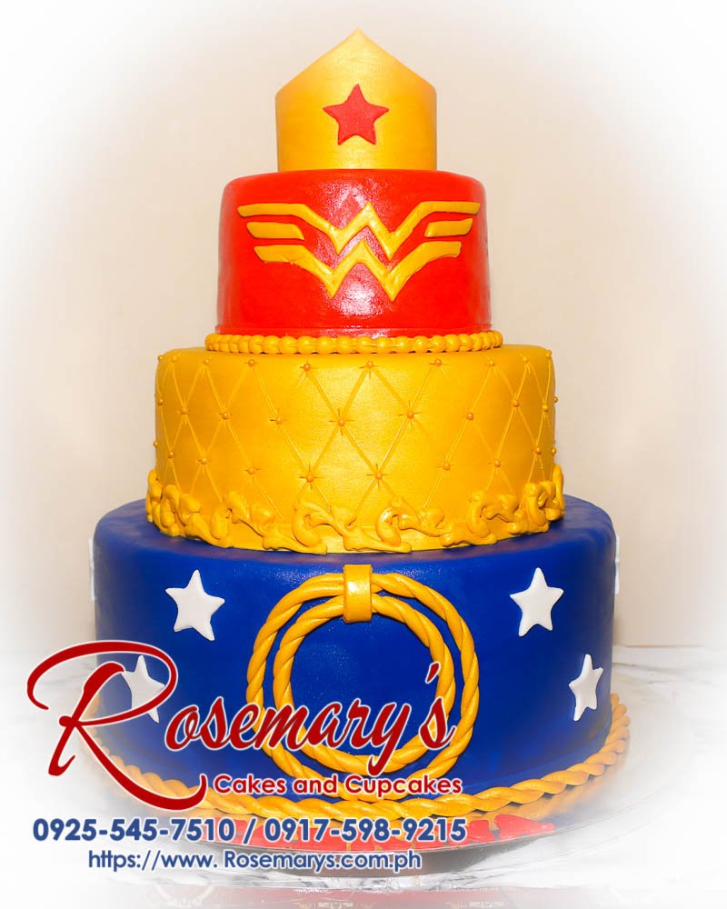 Delicious 3-layer Wonder Woman themed cake in blue, gold, and red, crafted by Rosemary's Cakes. Contact: 0925-545-7510.