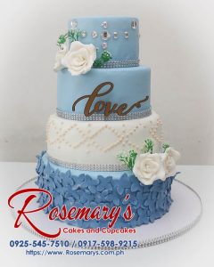 Delicious 4-layer blue and white wedding cake featuring a stunning 3D printed topper. Order your dream cake from Rosemary's Cakes: 0917-598-9215