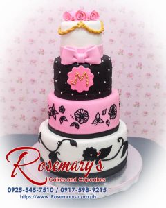 4 layer pink, black, and white birthday cake with elegant ribbon detailing, crafted by Rosemary's Cakes. Contact: 0925-545-7510.