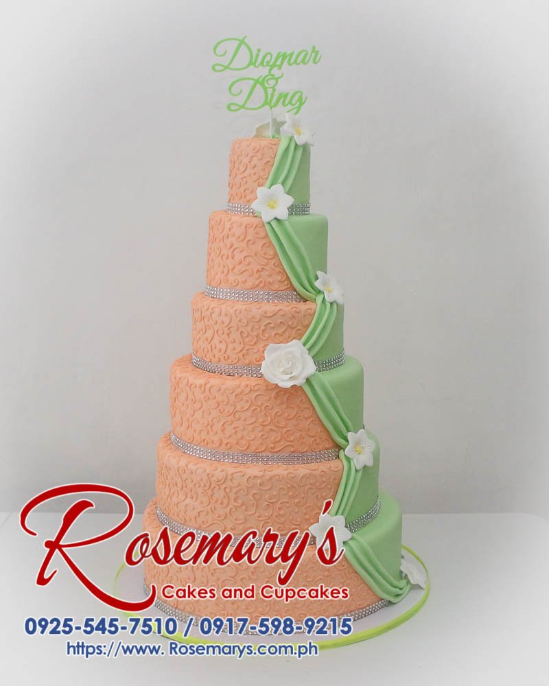 Six-layer orange and green wedding cake adorned with a custom 3D printed topper. Delicious and beautifully themed for your special day. Rosemary's Cakes: 0925-545-7510