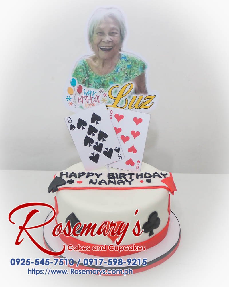 Cake for Nanay Luz’s Birthday Delicious one-layer themed cake adorned with festive cards, perfect for birthdays. Order yours from Rosemary's Cakes! Call 0917-598-9215.