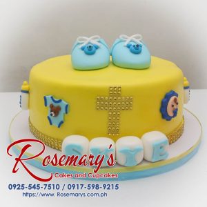 Delicious yellow christening cake with a fondant shoe topper. Order your themed cakes from Rosemary's Cakes! 0917-598-9215