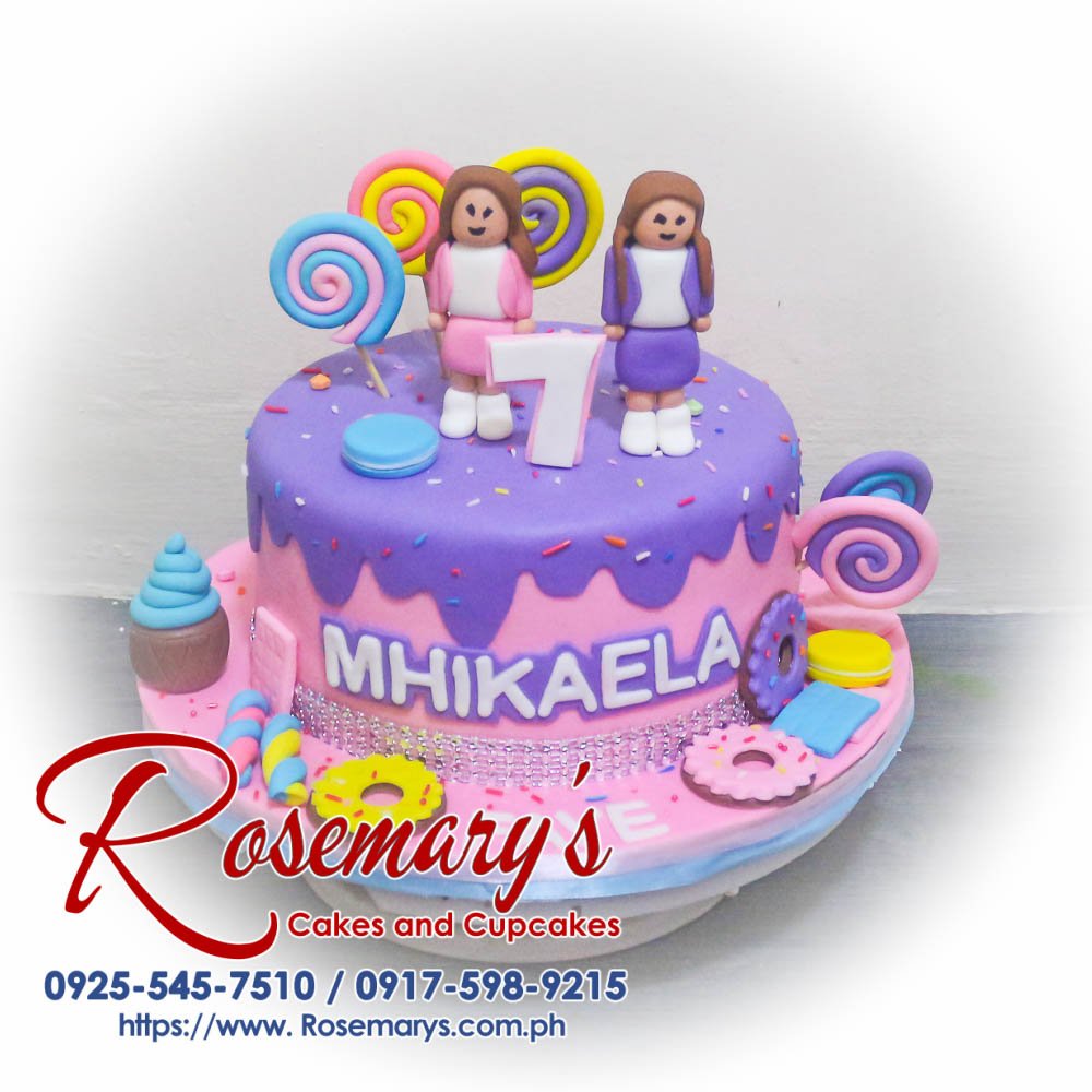 Delicious pink and purple Candyland Roblox themed cake by Rosemary's Cakes, perfect for a wedding anniversary. Contact: 0917-598-9215.