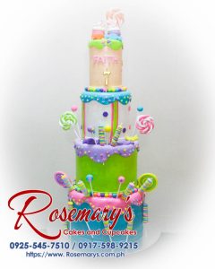 Delightful Candyland-themed 4-layer cake with vibrant colors and sweets. Perfect for celebrations. Contact Rosemary's Cakes at 0917-598-9215.