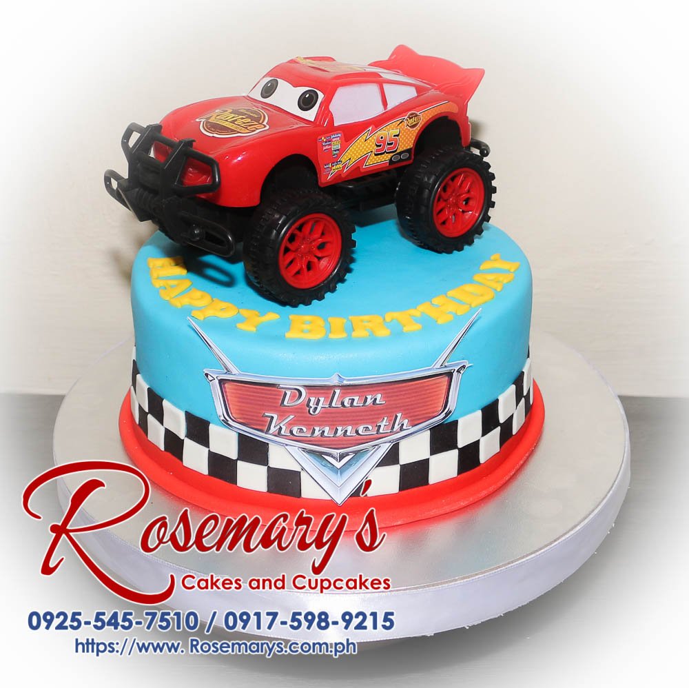 Cars Themed Cake for Dylan Kenneth Delicious 1-layer Cars themed cake featuring Lightning McQueen, crafted by Rosemary's Cakes. Contact: 0917-598-9215.