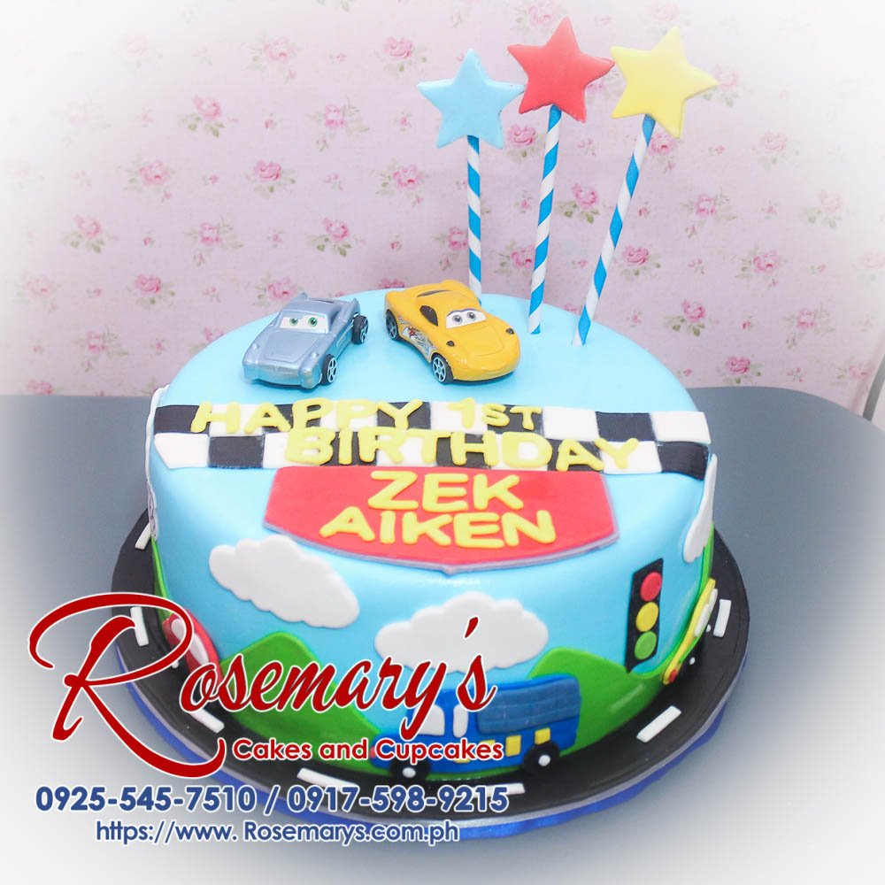 Delicious blue cars themed cake from Rosemary's Cakes, perfect for any celebration. Contact: 0925-545-7510.