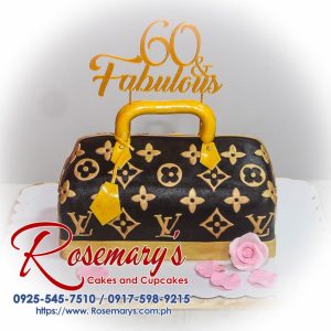 Designer bag themed cake featuring a 3D printed topper, gold accents, and "60 and Fabulous" detail. Crafted by Rosemary's Cakes, contact 0917-598-9215.