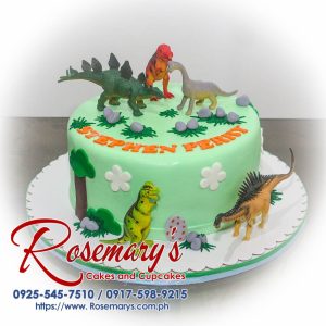 One-layer chocolate cake decorated with green frosting and fondant dinosaurs. For a prehistoric celebration! Rosemary's Cakes - 0917-598-9215