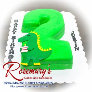 Delicious green dinosaur-themed number cake by Rosemary's Cakes, perfect for celebrations. Contact: 0917-598-9215.