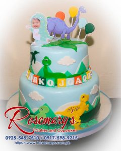 Delicious 2-layer dinosaur themed cake by Rosemary's Cakes, perfect for a birthday celebration. Contact: 0917-598-9215.