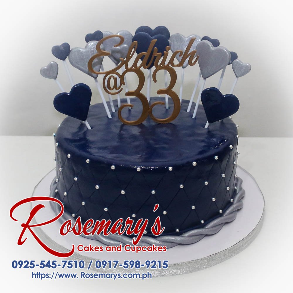 Blue one-layer heart-shaped cake decorated with delicate white hearts. Order your custom cake from Rosemary's Cakes: 0925-545-7510.