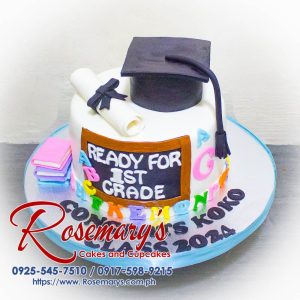 One-layer chocolate cake decorated with colorful fondant graduation caps and "Ready for First Grade" message. Delicious cakes by Rosemary's Cakes. Call 0917-598-9215.