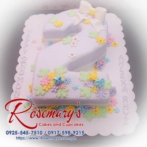 Delicious white number cake with vibrant decorations for a 2nd-month celebration. From Rosemary's Cakes, call 0925-545-7510.
