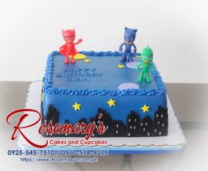 Single-layer black cake decorated with blue PJ Masks accents. Perfect for superhero fans! Order yours from Rosemary's Cakes: 0925-545-7510