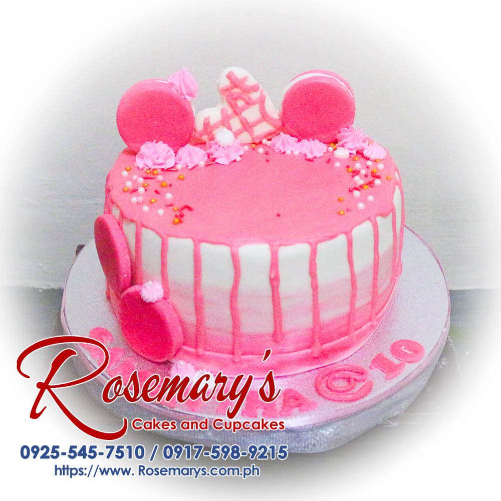 Delicious pink hearts drip cake adorned with elegant sprinkles, perfect for birthdays. Order from Rosemary's Cakes at 0925-545-7510.