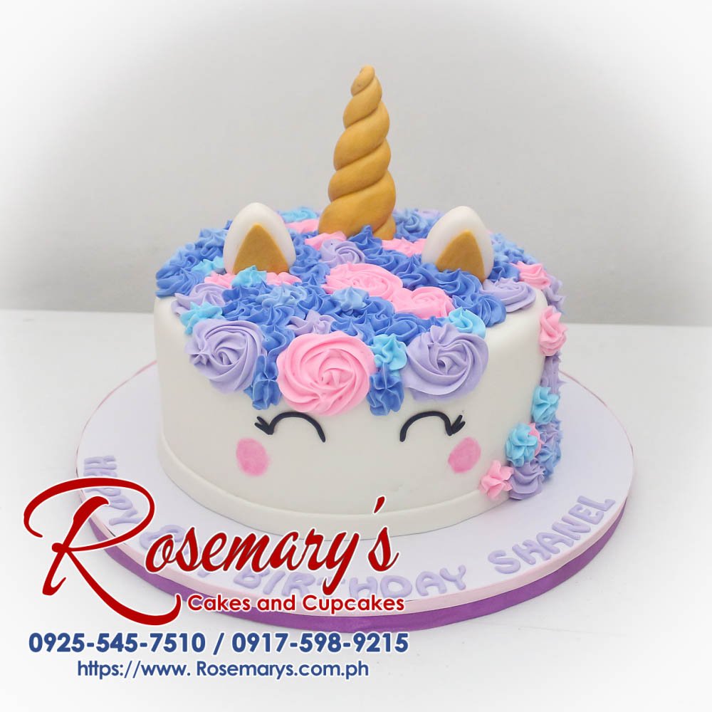 Purple and pink unicorn-themed cake adorned with edible glitter and a fondant horn. Perfect for magical celebrations! Order yours from Rosemary's Cakes: 0925-545-7510.