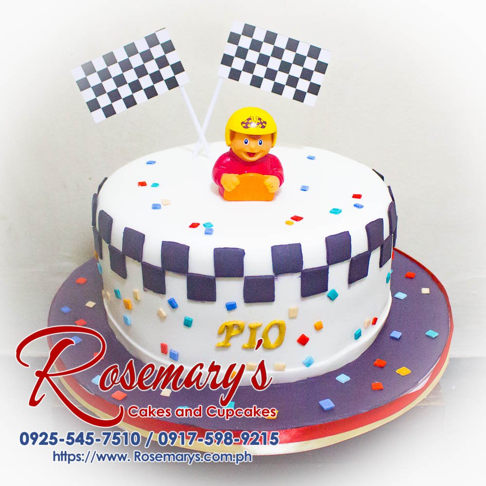 Race Car Driver Themed Cake for Pio Delicious one-layer cake decorated with a fondant race car theme. Perfect for birthdays and celebrations! Order yours from Rosemary's Cakes: 0917-598-9215.
