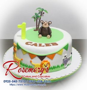 Delicious one-layer white cake decorated with fondant animals like a monkey, giraffe, lion, and zebra. Perfect for a safari-themed celebration! Rosemary's Cakes 0925-545-7510