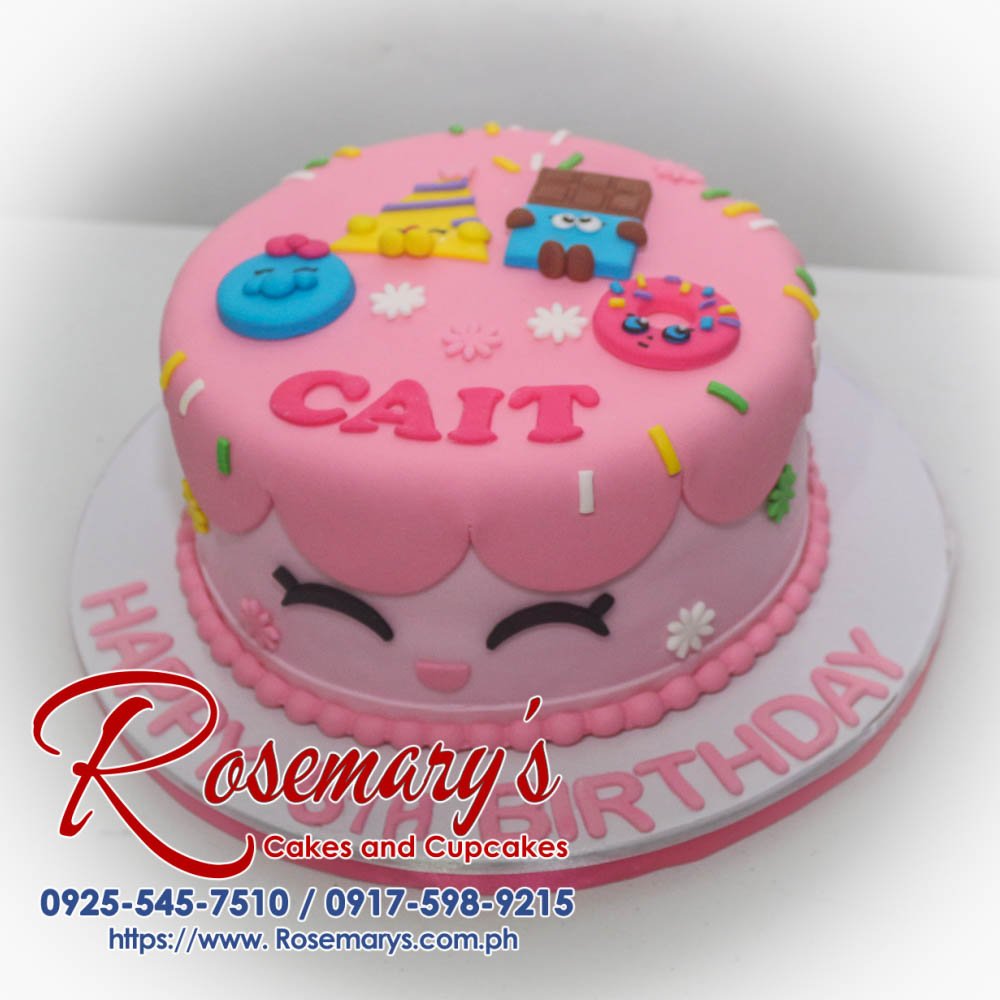 Delicious one-layer pink Shopkins themed cake with vibrant frosting and playful decorations. Order yours from Rosemary's Cakes! 0925-545-7510