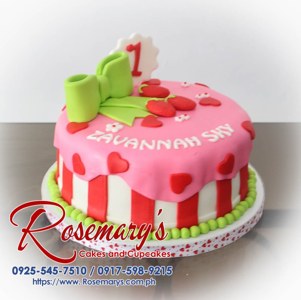 Delicious one-layer pink and green cake decorated with a pink ribbon and fresh strawberries, perfect for any celebration. Order yours from Rosemary's Cakes! Call 0925-545-7510.