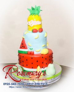 Tropical fruit themed 3 layer cake from Rosemary's Cakes, showcasing vibrant fruits and creamy frosting. Contact: 0917-598-9215.