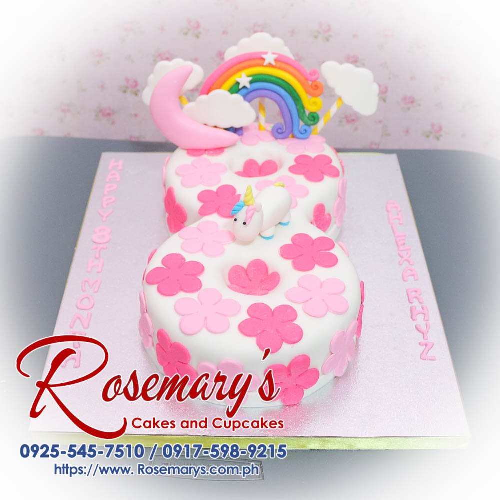 Colorful unicorn number cake featuring pink and rainbow layers, adorned with whimsical sprinkles. From Rosemary's Cakes, 0917-598-9215.
