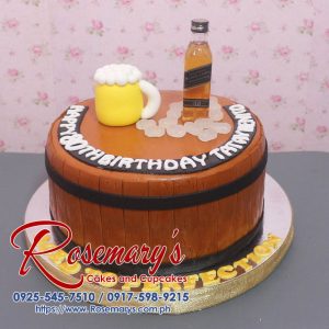 Delicious whiskey-themed cake, adorned with a brown barrel design, perfect for celebrations. Order from Rosemary's Cakes: 0917-598-9215.