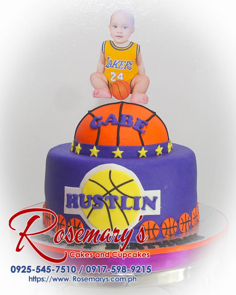 2 Layer Basketball Themed Cake for Gabe Delicious 2 layer basketball themed cake in violet, perfect for any sports fan. Order from Rosemary's Cakes at 0917-598-9215.