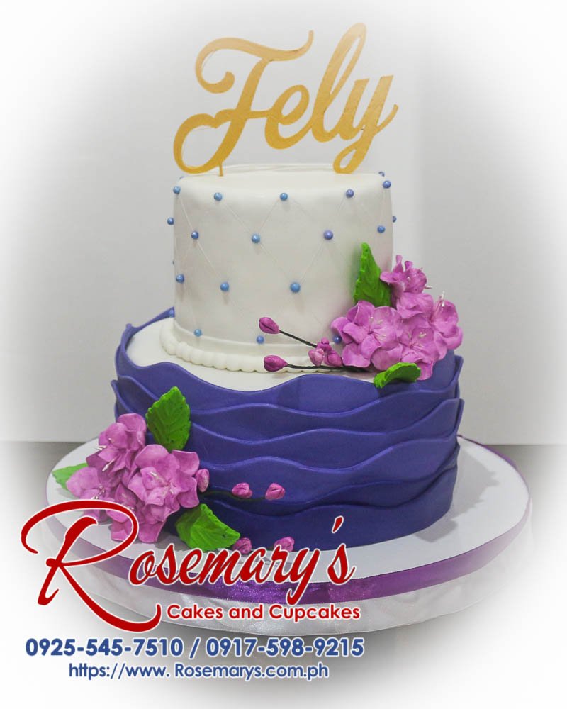 Delicious 2 layer blue and purple themed cake with 3D printed flowers, crafted by Rosemary's Cakes. Contact: 0925-545-7510.