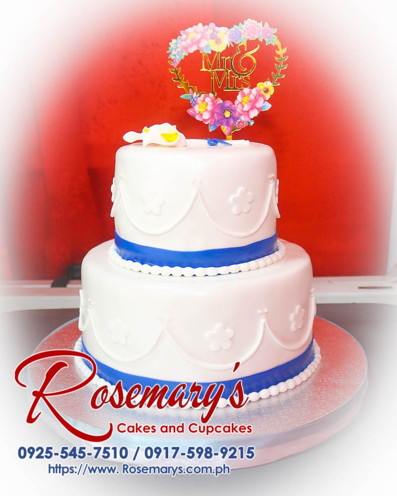 Elegant 2 layer white and blue wedding cake featuring 