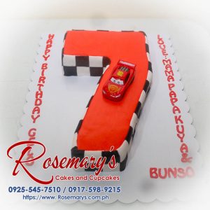 Rich red number cake featuring vibrant car decorations, perfect for a 7th birthday celebration. Order at Rosemary's Cakes: 0917-598-9215.