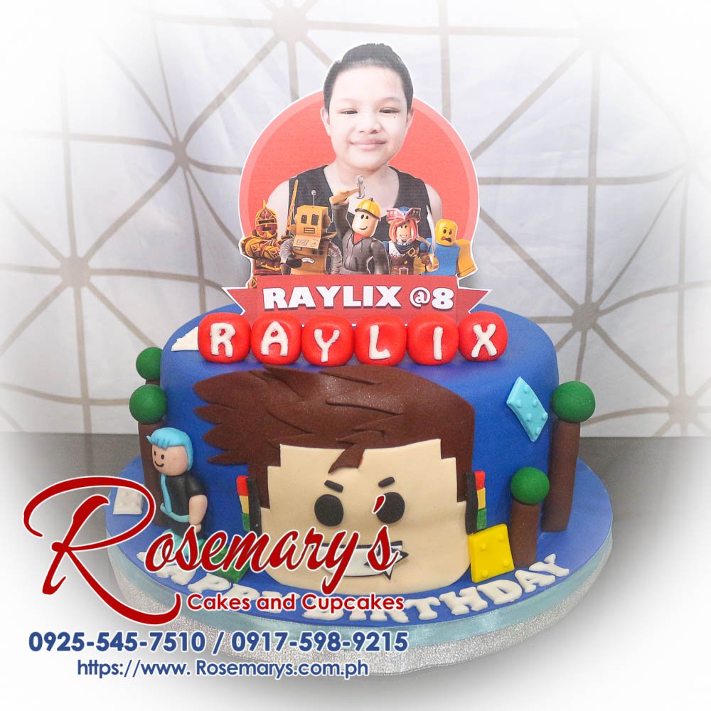 Roblox Themed Cake for Raylix’s 8th Birthday Blue 1-layer Roblox themed cake, decorated with vibrant designs, perfect for any celebration. Order from Rosemary's Cakes, 0925-545-7510.