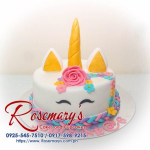 Delicious pastel pink unicorn themed cake by Rosemary's Cakes, perfect for celebrations. Contact 0917-598-9215.