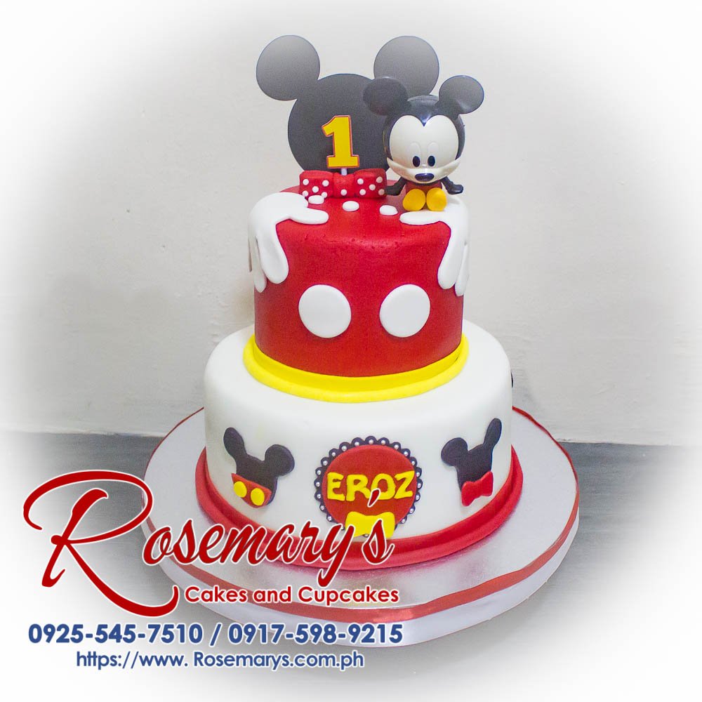 2 Layer Baby Mickey Mouse Themed Cake for Eroz’s 1st Birthday 2-layer baby Mickey Mouse themed cake, decorated with vibrant colors and playful characters, perfect for any celebration. Rosemary's Cakes 0925-545-7510.