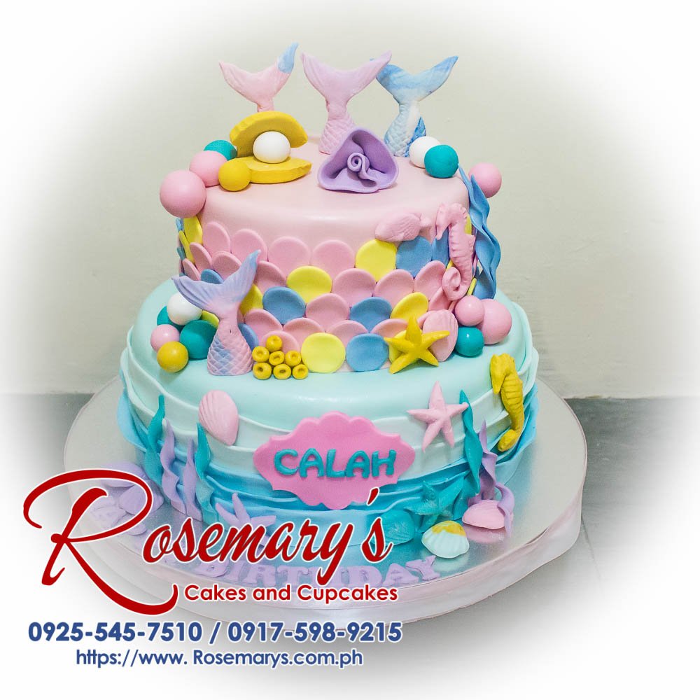 Delicious 2 layer pastel mermaid themed cake, adorned with under the sea decorations. Order from Rosemary's Cakes: 0917-598-9215.