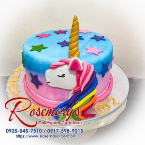 Vibrant rainbow unicorn cake with colorful layers, perfect for celebrations. Order delicious cakes at Rosemary's Cakes, 0917-598-9215.