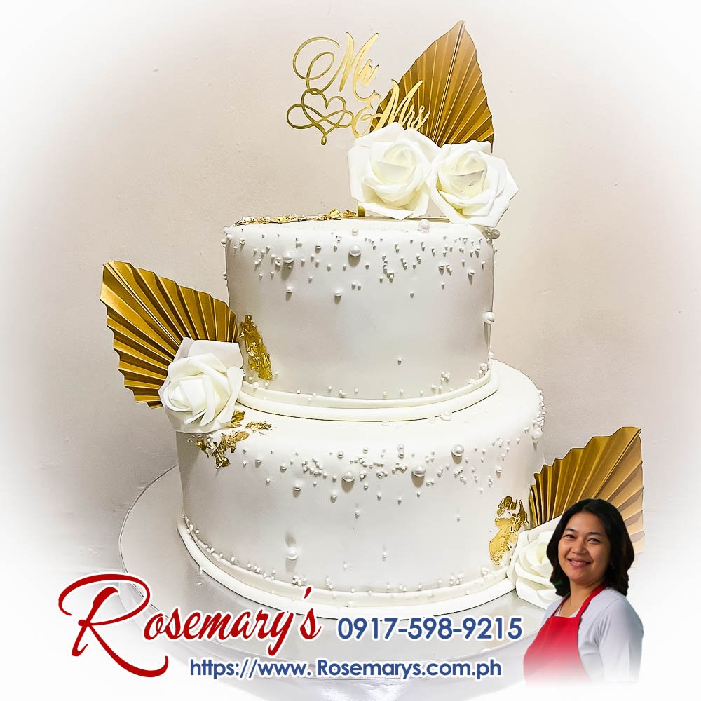 Elegant 2-layer white and gold wedding cake by Rosemary's Cakes. Perfect for Mr. and Mrs. theme. Contact: 0917-598-9215.
