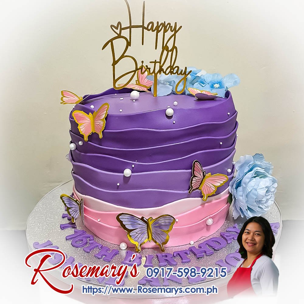 Beautiful pink and purple ombre cake adorned with butterflies, perfect for vibrant celebrations. From Rosemary's Cakes, call 0917-598-9215.