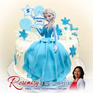 Delicious Elsa Frozen themed cake with icy blue details, perfect for birthdays. Order from Rosemary's Cakes, contact 0917-598-9215.
