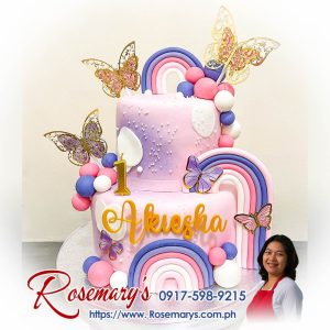 2 layer rainbow butterflies themed cake with vibrant colors and delicate butterfly decorations by Rosemary's Cakes, 0917-598-9215.