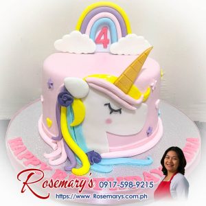 Rainbow unicorn themed cake with vibrant rainbow layers and unicorn decorations, a delicious and yummy cake by Rosemary's Cakes. Call 0917-598-9215.